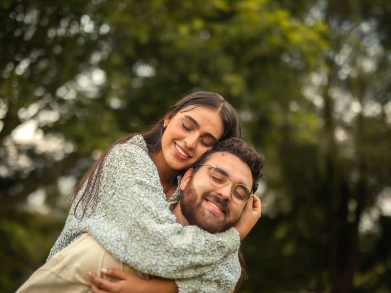 Couple embracing outdoors, representing hope and healing after betrayal trauma